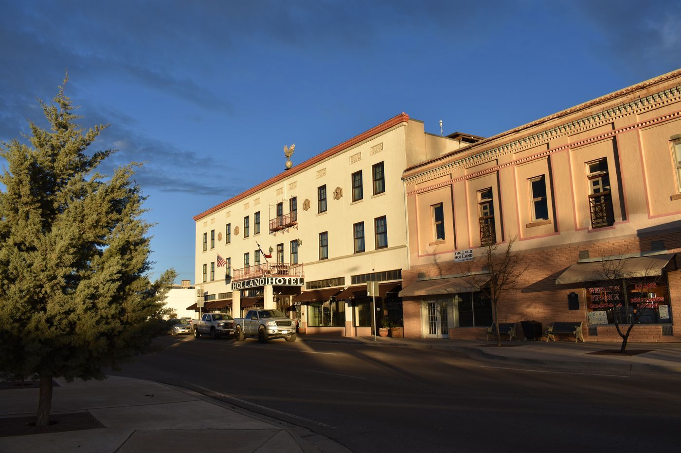 The Holland Hotel on a quiet corner in downtown Alpine, Texas, in early morning light