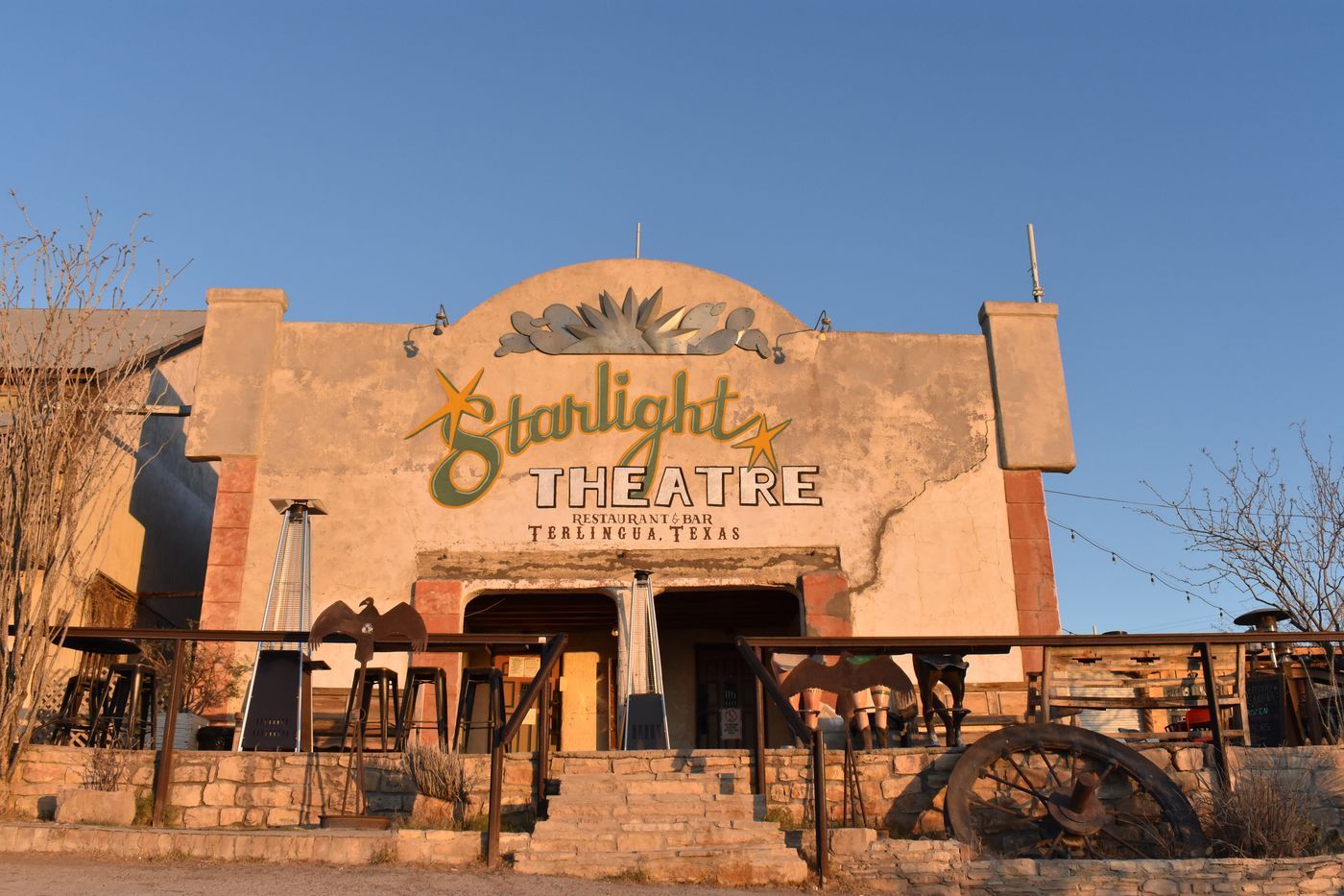 The painted adobe facade of the Starlight Theatre restaurant and bar in Terlingua, Texas
